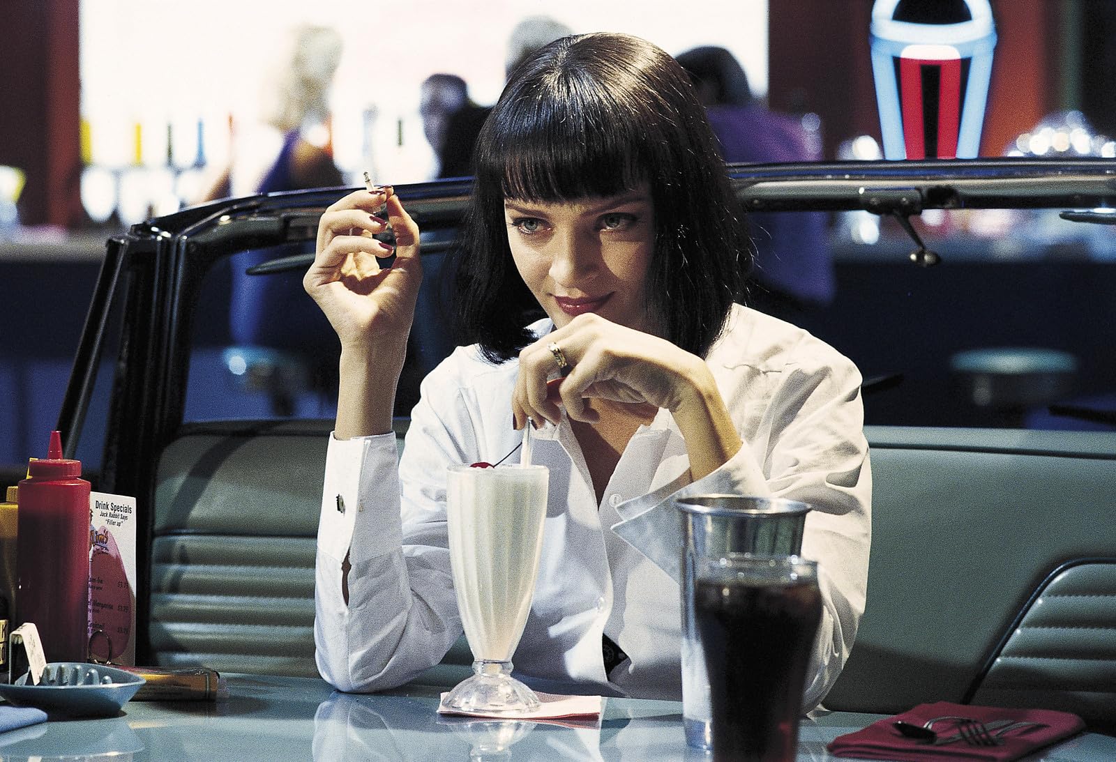 Pulp Fiction still of Vincent and Mia dancing the twist contest